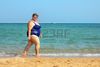 10213901-overweight-woman-walking-on-sea-beach.jpg